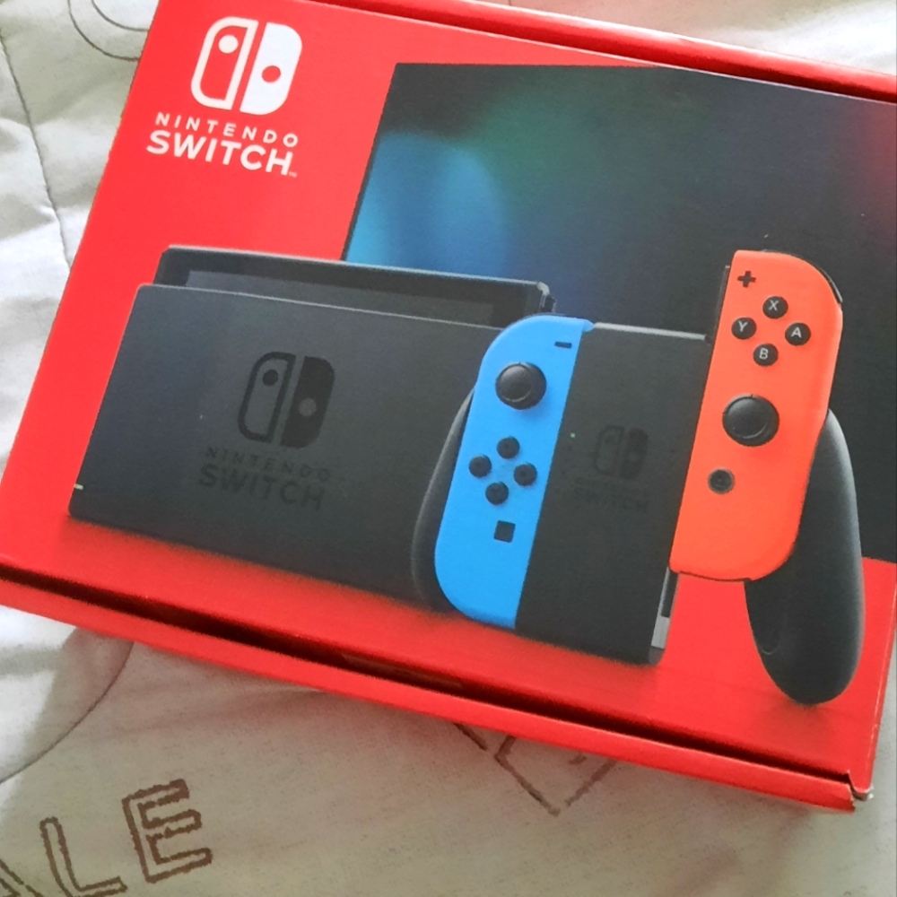 Brand New Nintendo Switch Console with Bright Blue and Red Controllers